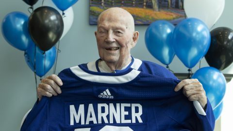 Ross is smiling with a Marner's Toronto Maple Leafs uniform.